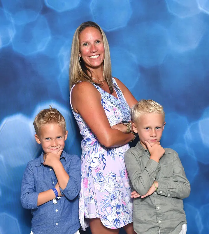 Crystal Snow, founder of Snow & Sons Roofing, with her two sons